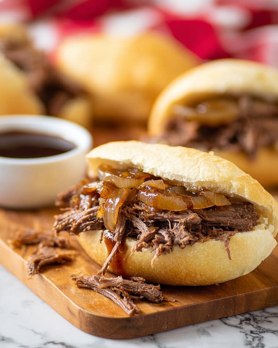 A close-up view of a sandwich on a soft, slightly toasted white bun, filled with shredded brown meat and topped with cooked, translucent caramelized onions. The sandwich rests on a wooden board with a few meat shreds beside it. In the background, more sandwiches on similar buns are blurred, along with a small white bowl of dark sauce. The scene is set on a white marbled surface with a red and white checkered cloth partially visible behind. Photo taken with an iphone --ar 4:5 --v 7