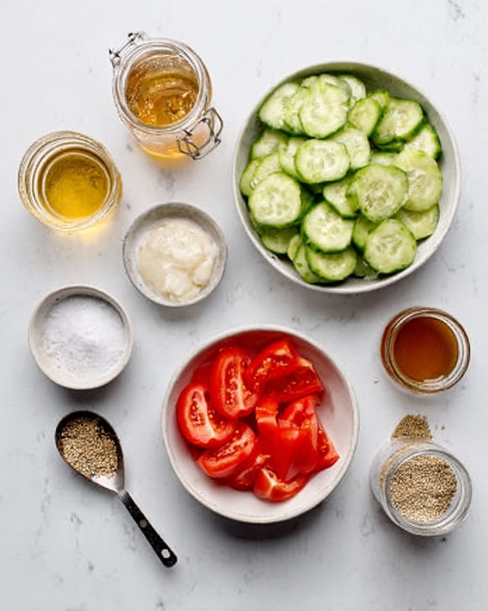 The image shows a white bowl filled with green cucumber slices at the center top, a white bowl with red tomato slices below it, and several small containers around them on a white marbled surface. To the left, there is a glass jar with a golden liquid, a small white bowl with a creamy white substance, and another white bowl with white salt. To the right, there is a metal measuring spoon with mixed seeds, a small white bowl with a tan dressing, and a small glass jar filled with a brown liquid. The overall setting is neat and bright, with a focus on fresh ingredients. Photo taken with an iphone --ar 4:5 --v 7