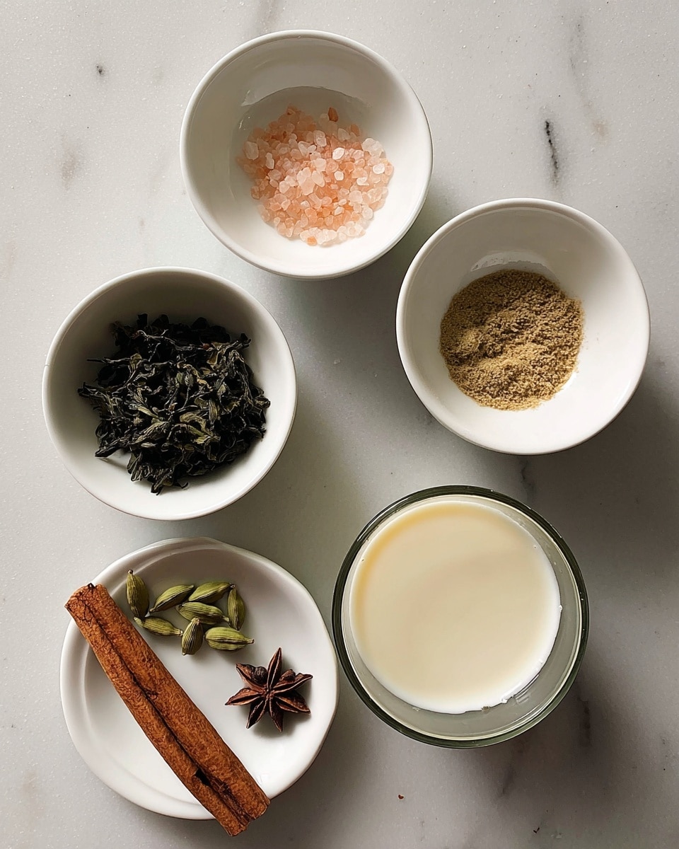 Five white small bowls and a glass cup are placed on a white marbled surface in a circle. The top left bowl contains a few pink salt crystals. The top right bowl holds light brown fine granules. The bottom left bowl has dark green dried tea leaves. The glass cup at the bottom right is filled with creamy milk. In the center, a white plate holds one medium brown cinnamon stick, one dark brown star anise, and three small green cardamom pods. photo taken with an iphone --ar 4:5 --v 7