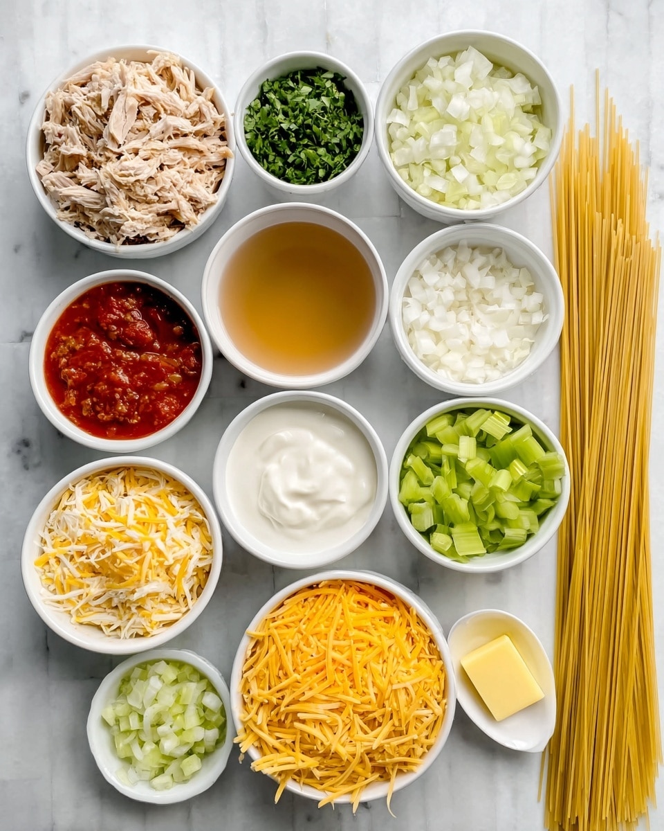 The image shows 12 small white bowls and one bundle of dry spaghetti pasta placed on a white marbled surface. The bowls hold different chopped and prepared ingredients arranged in neat rows: shredded light brown cooked chicken in the top left bowl, finely chopped green herbs in the top middle bowl, small white diced onions in the top right bowl, yellow melted butter in the middle right bowl, creamy white sour cream or yogurt in the middle right center bowl, yellow-orange shredded cheddar cheese in the bottom right bowl, shredded light-colored cheese in the bottom middle bowl, chopped green bell peppers in the bottom left bowl, finely diced celery next to it, and a small white bowl with light brown chicken broth to the left beside the sour cream. There is also a small amount of red tomato sauce with herbs in the middle top bowl and a small piece of butter next to the sour cream. On the far right side, a bundle of uncooked spaghetti pasta lies flat on the white marbled surface. Photo taken with an iphone --ar 4:5 --v 7