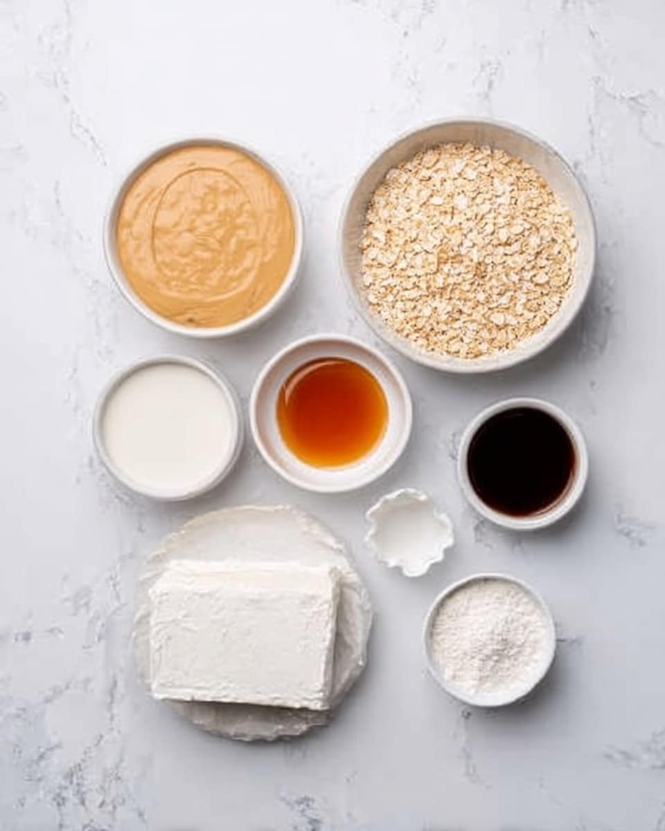 The image shows seven white bowls placed on a white marbled textured surface. Starting from the top left, the first bowl has a smooth light tan sauce with a creamy texture. To its right, a small white bowl contains a clear amber liquid. Further right, a large white bowl is filled with dry light beige cereal or flakes. Below these, on the left side, a small white bowl holds white liquid, likely milk, and next to it to the right, there is a small white bowl with a very dark liquid, almost black. Centered below those bowls is a pack of white soft cheese wrapped in paper. To the right of the cheese, a small white bowl contains a fine white powder. The overall look is clean and organized, with a white marbled background. Photo taken with an iphone --ar 4:5 --v 7