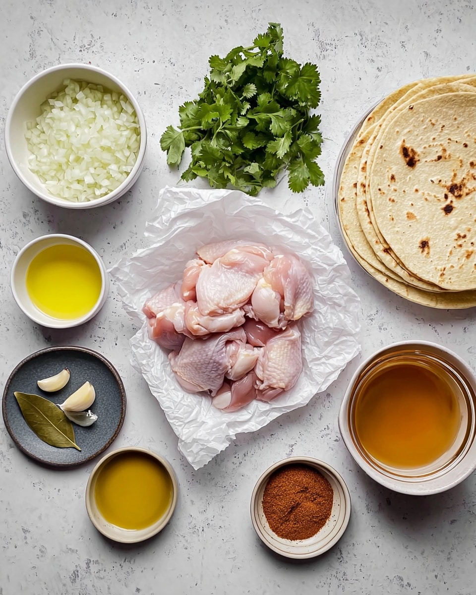 The image shows several cooking ingredients arranged on a white marbled surface. In the center, there is a white crumpled paper holding raw pink chicken thighs stacked in a small pile. To the left, a white bowl contains finely chopped white onions, above which is a bunch of fresh green cilantro and a small white bowl of golden yellow liquid, likely melted butter. Next to the butter, a small dark gray plate holds a green bay leaf and chopped garlic. To the right of the chicken, a small white bowl contains yellow oil, and below it is a white bowl with a mound of reddish-brown spice powder. Lower right, there is a clear glass of amber broth, while above it, a white bowl holds a stack of lightly toasted tortillas with brown spots. The colors are soft and natural, with the ingredients clearly separated and neatly placed. photo taken with an iphone --ar 4:5 --v 7
