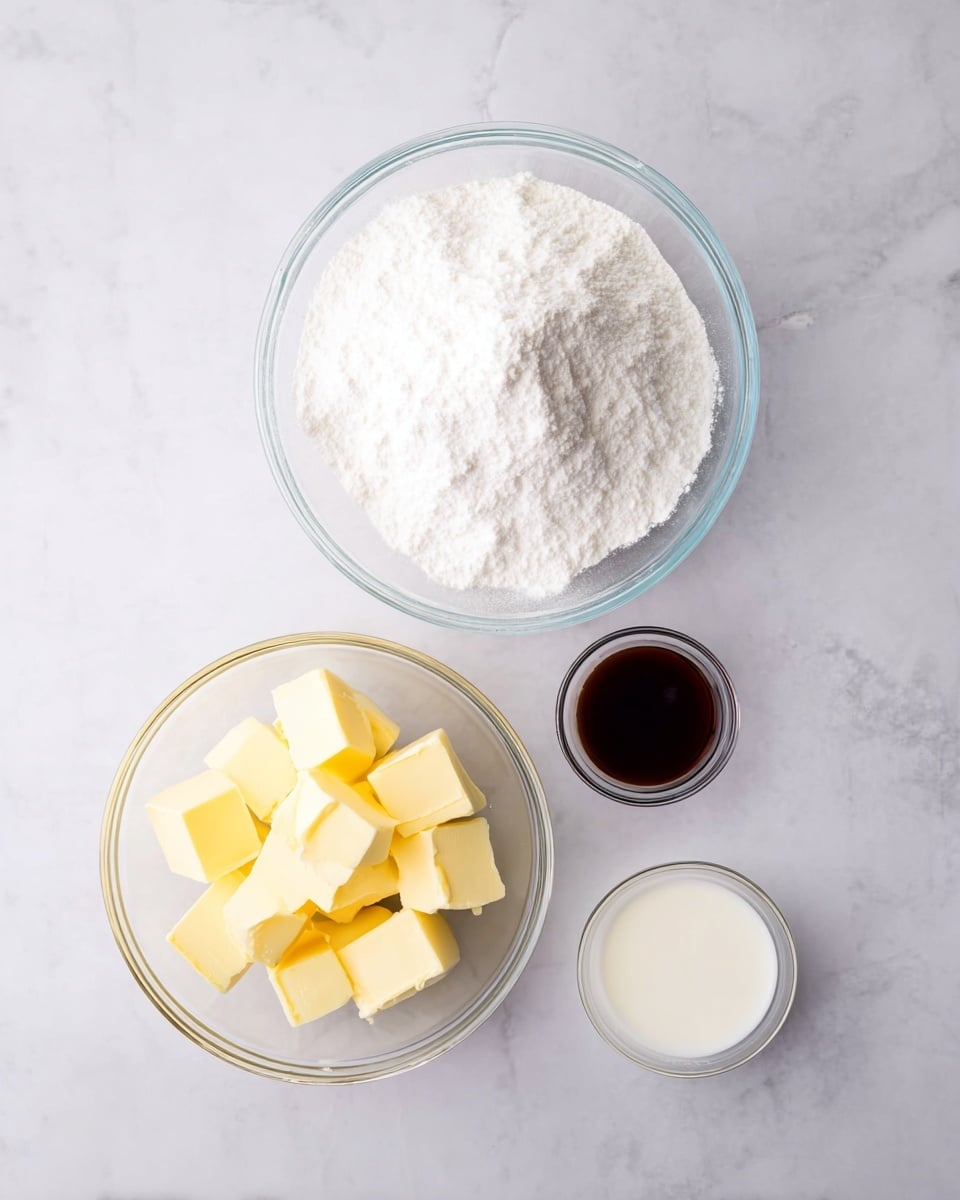 A top-down view of four clear glass bowls arranged on a white marbled surface: the largest bowl at the top holds a large mound of fine white powdered sugar with a light and fluffy texture; below it on the left is a medium bowl filled with neat cubes of pale yellow butter, smooth and slightly shiny; to the right of the butter bowl is a small bowl with dark brown vanilla extract, glossy and liquid; and next to the vanilla extract, at the far right, is the smallest bowl containing a small amount of white milk, smooth and creamy. Photo taken with an iphone --ar 4:5 --v 7
